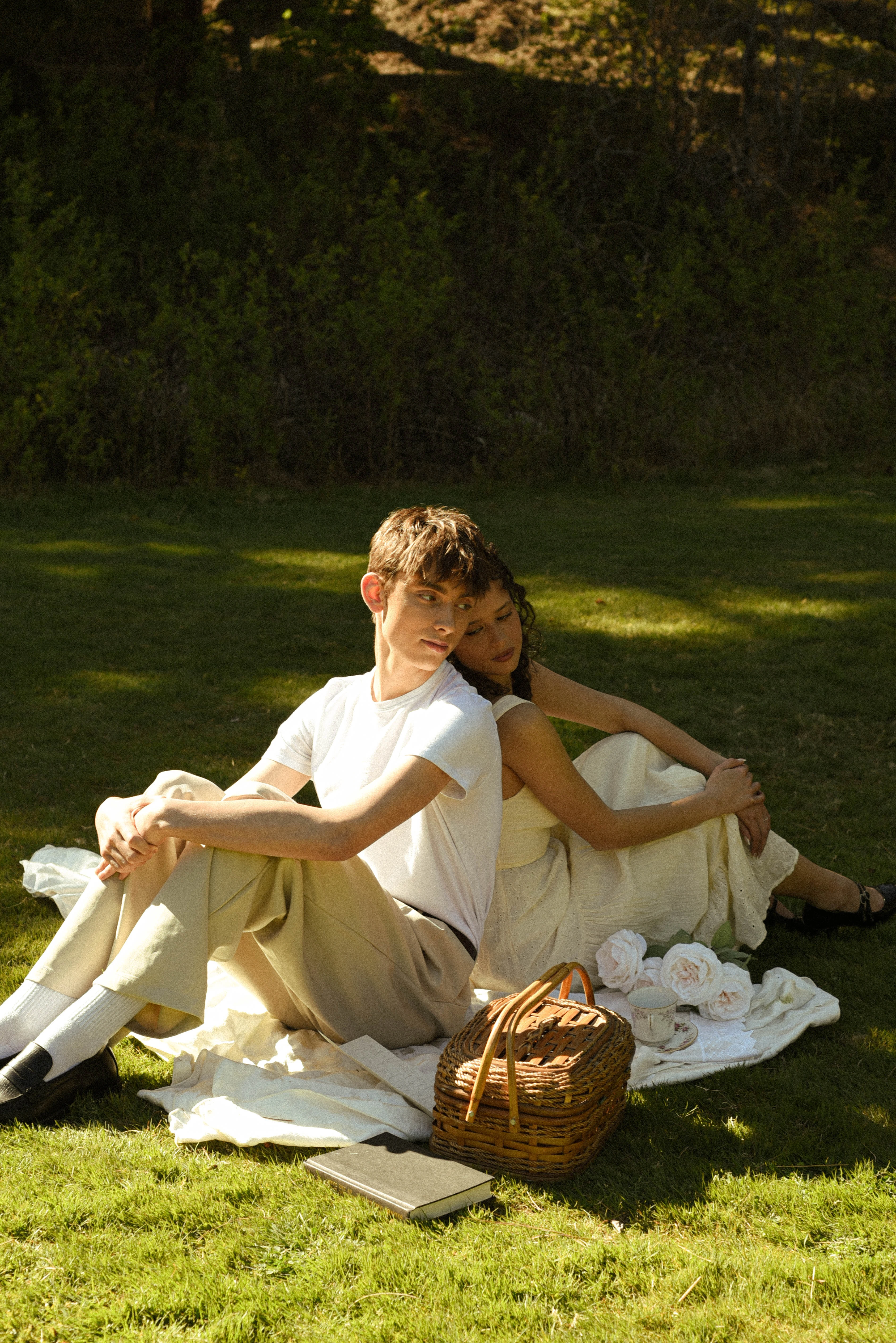 Couple sitting back to back