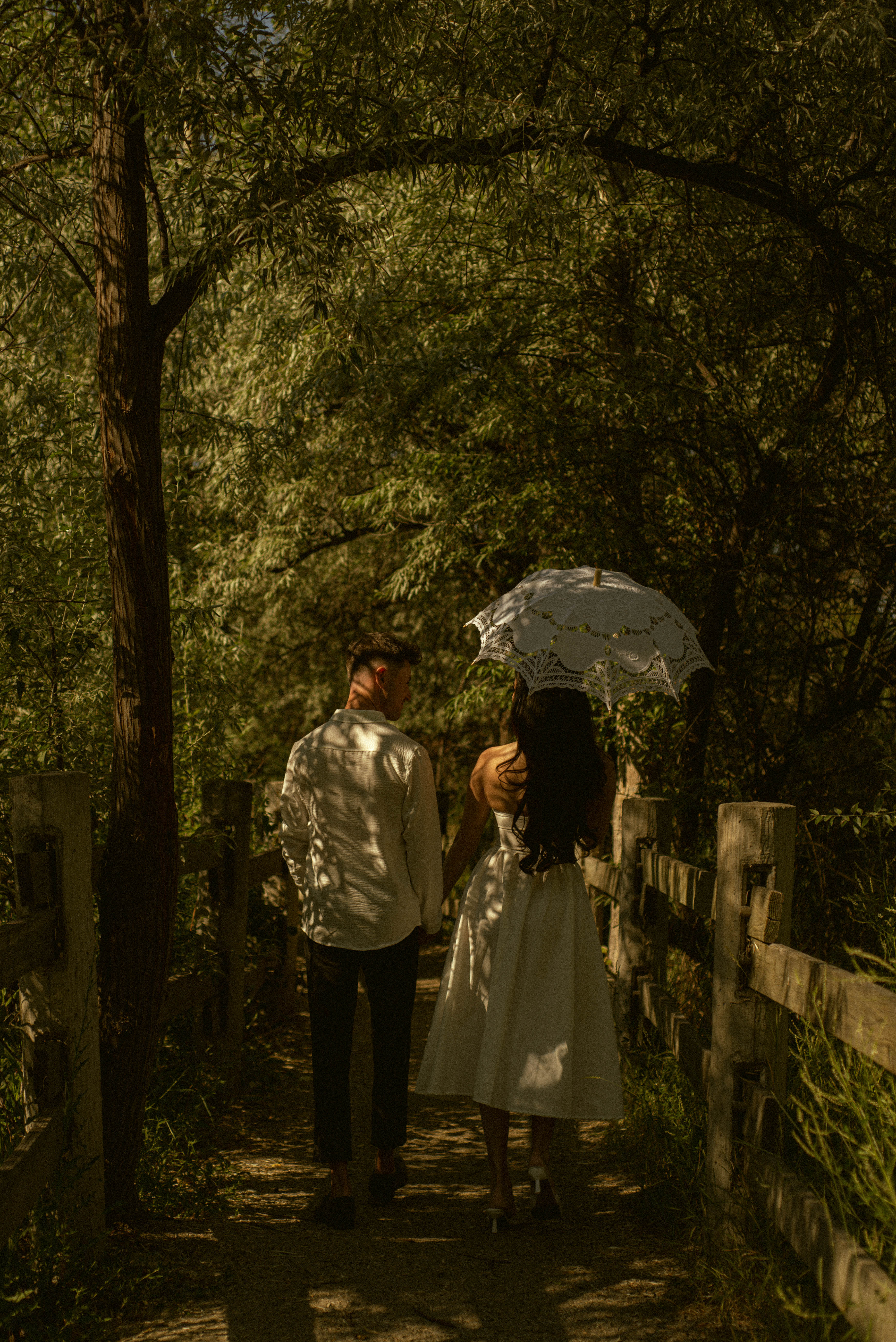Engaged Couple Walking with an Umbrella - Kelowna Proposal Photos