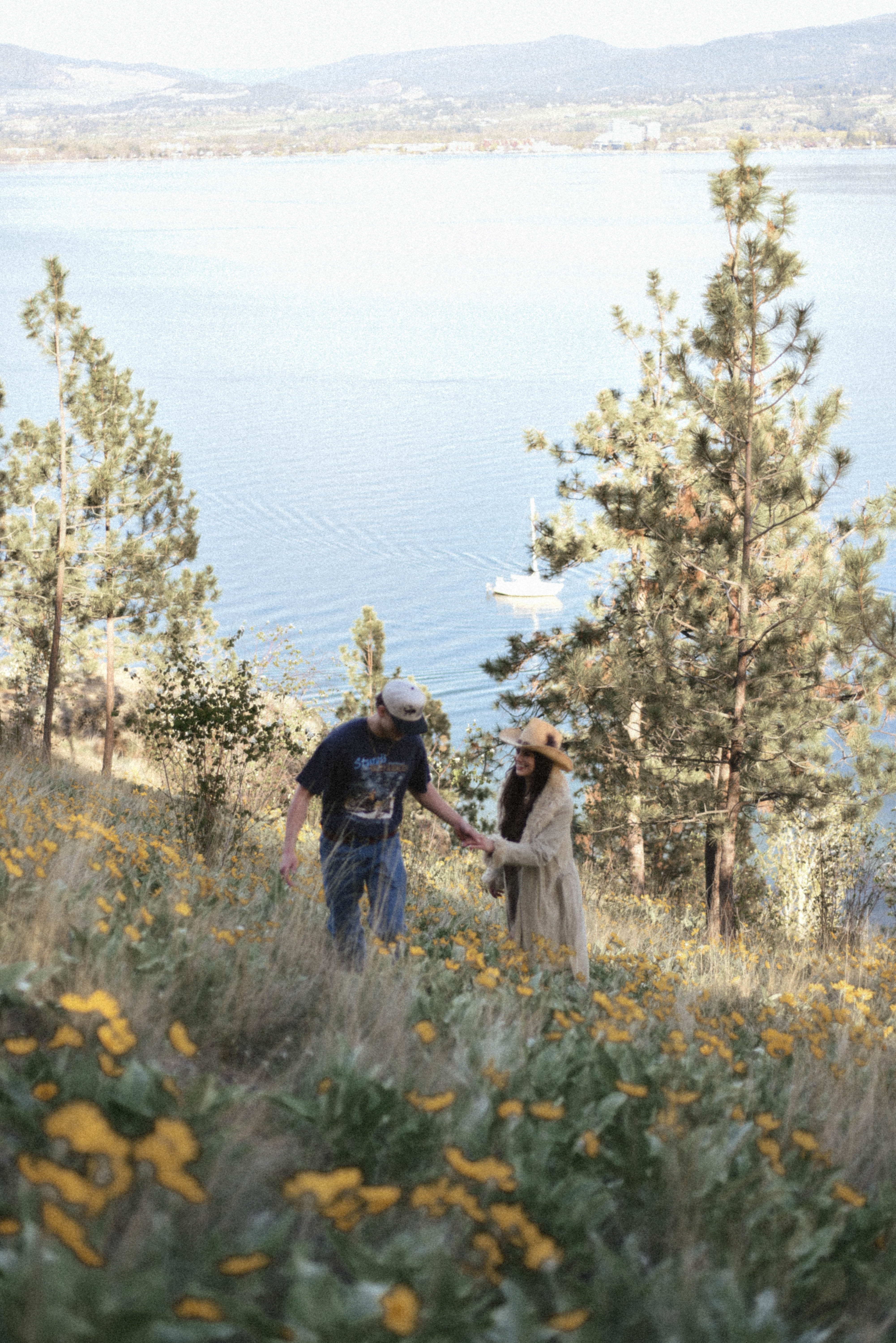 Couple running in field - Kelowna