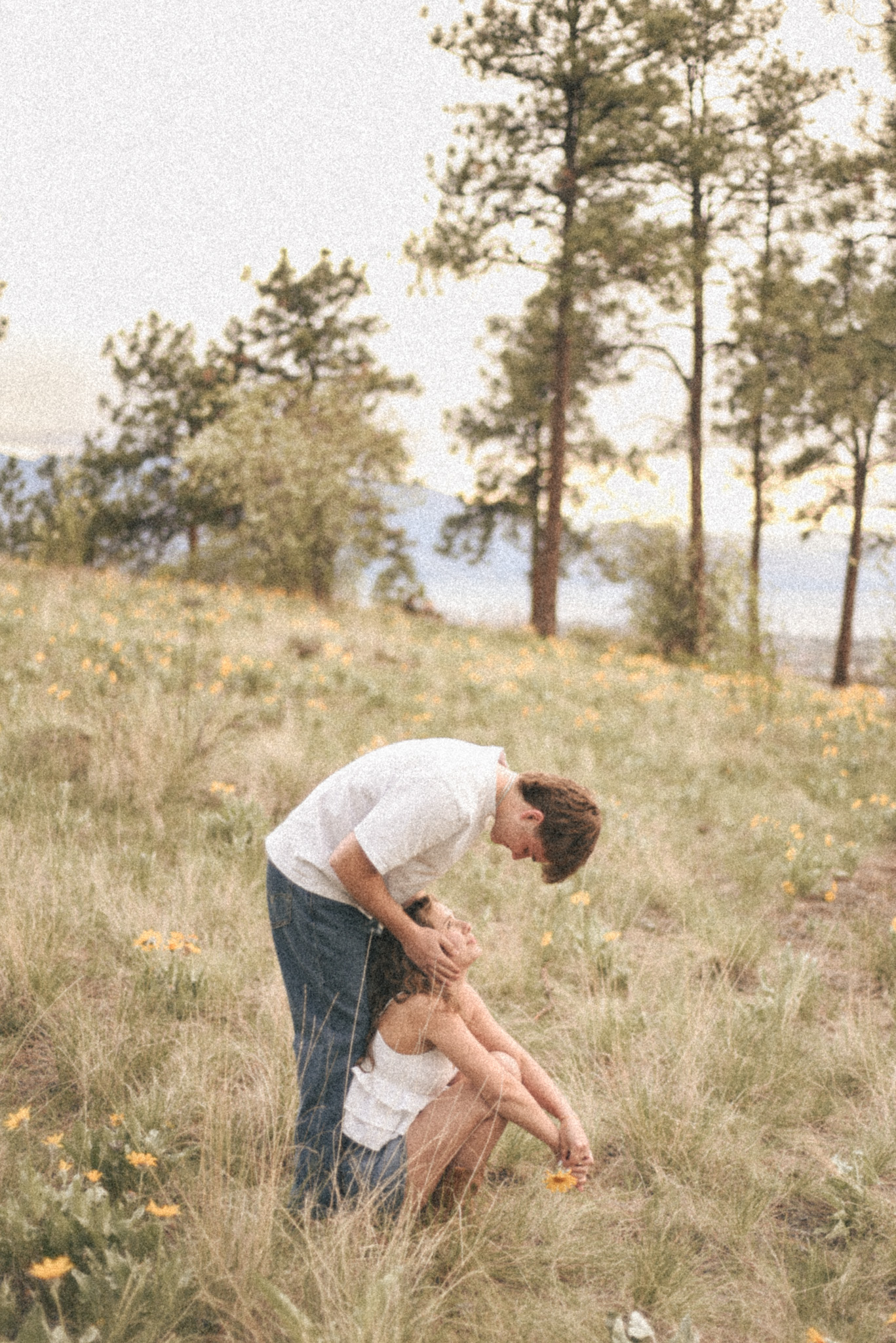 Couple standing and sitting
